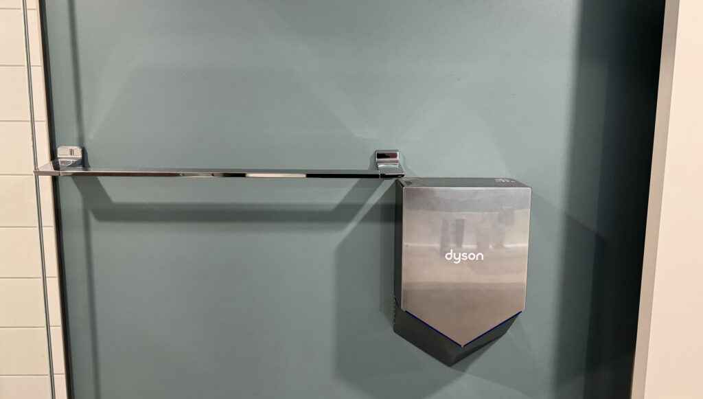 Towel bar and hand dryer placement; seems the electrical for the hand dryer was completed without measuring