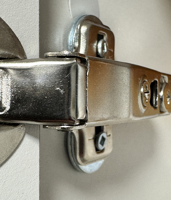 Washers behind hinge - Pinnacle Group Renovations