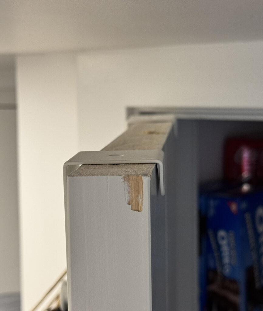 Splintered damage to top of closet door; no sanding