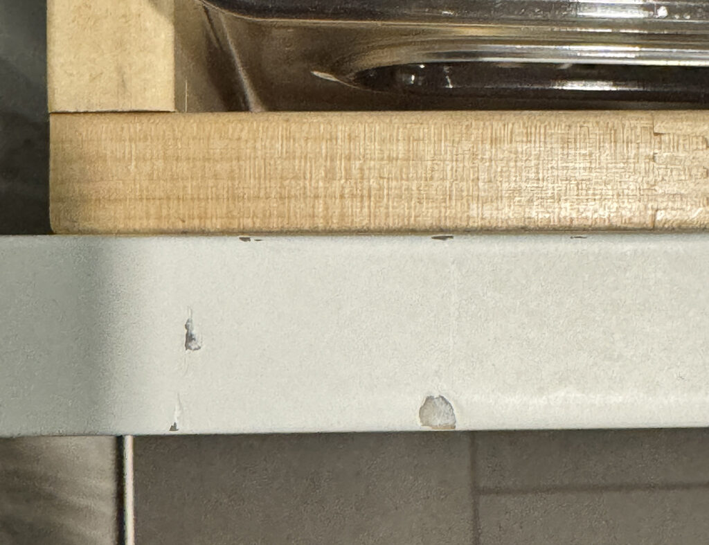 Damage to bottom vanity drawer (left side)
