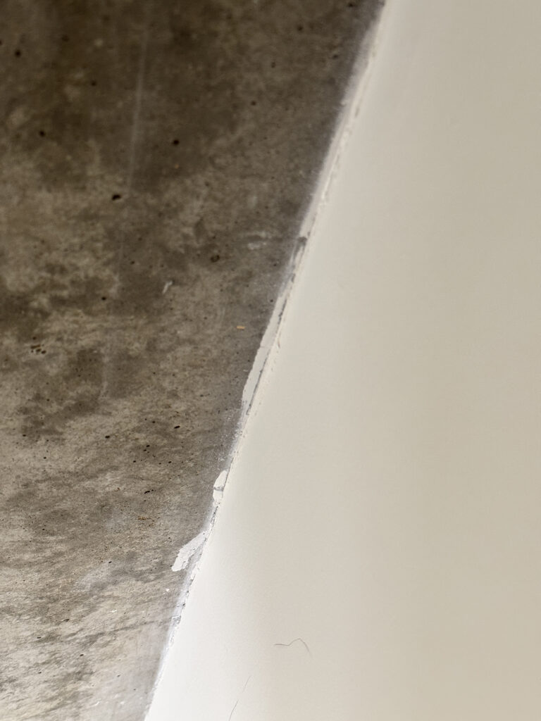 White paint on concrete ceiling
